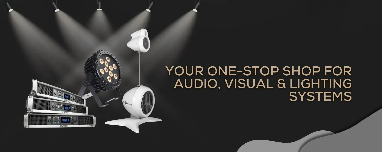 Amplifiers, a moving head fixture and loudspeakers under stage lighting